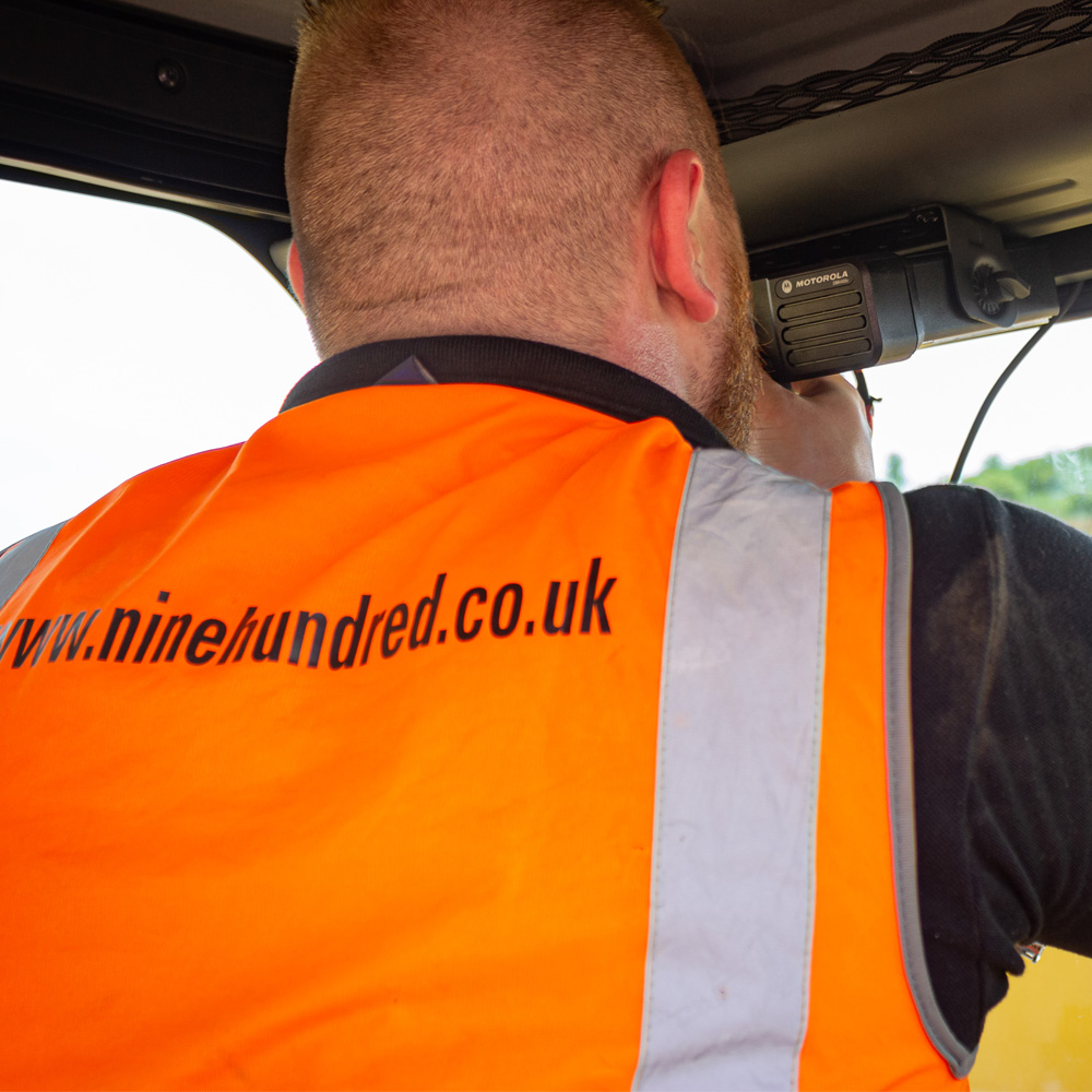 a bold man wearing a Hi Vis jacket installing a motorola intercom